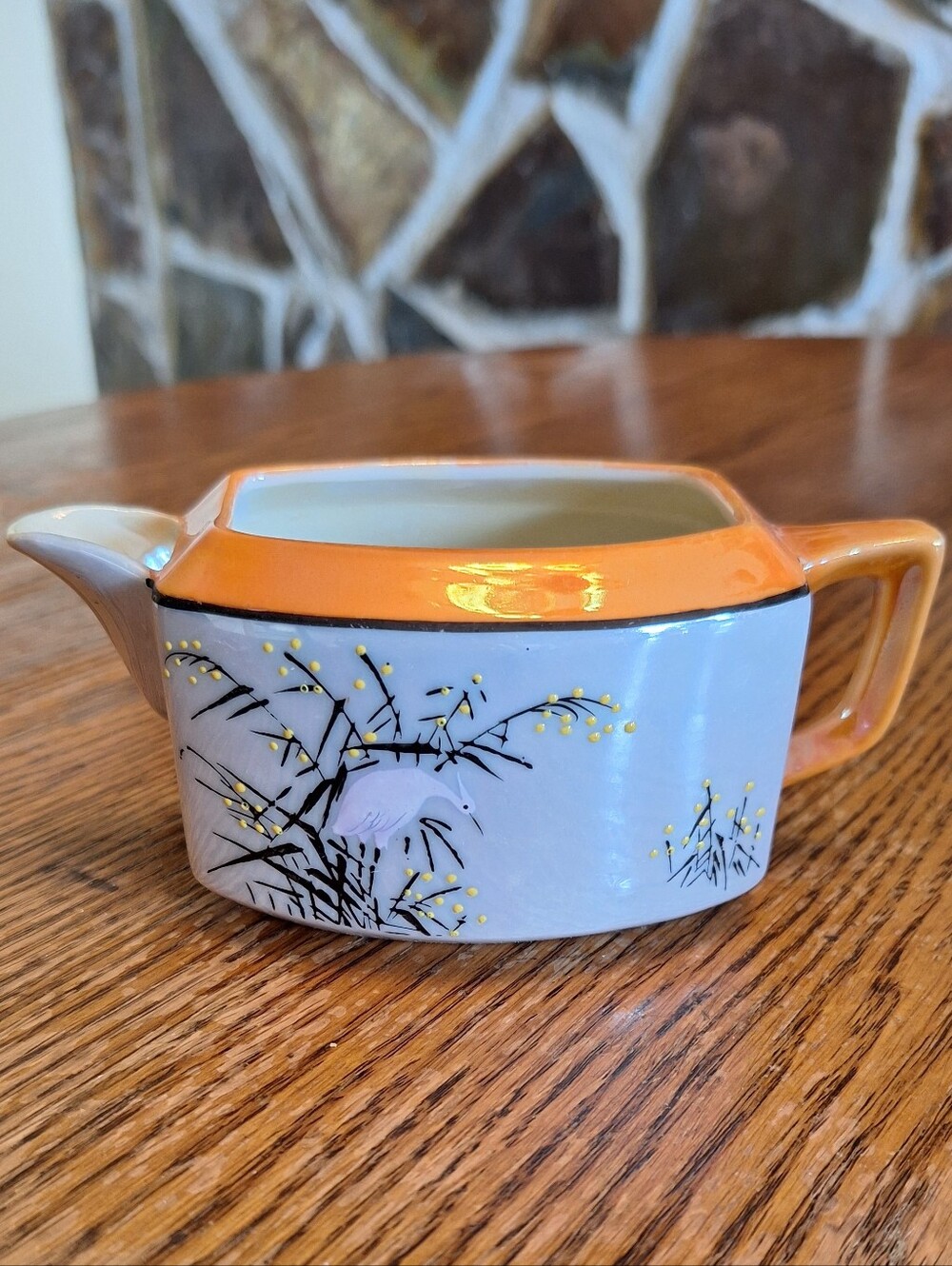 Old Orange and White Porcelain Creamer with Hand-Painted Floral Detail